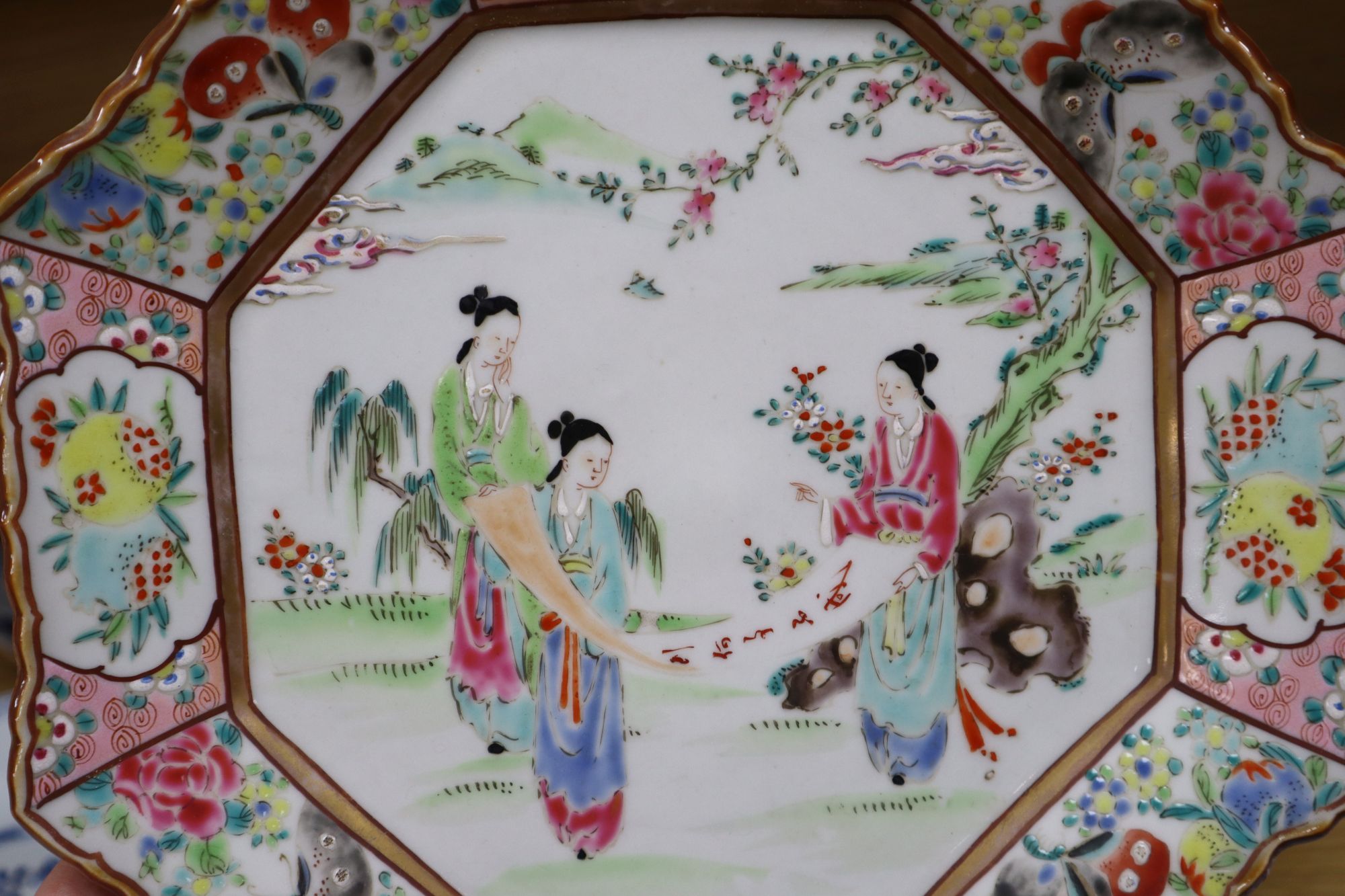 A collection of mostly 18th century Chinese export plates and dishes, a Chinese famille rose dish and another similar smaller dish